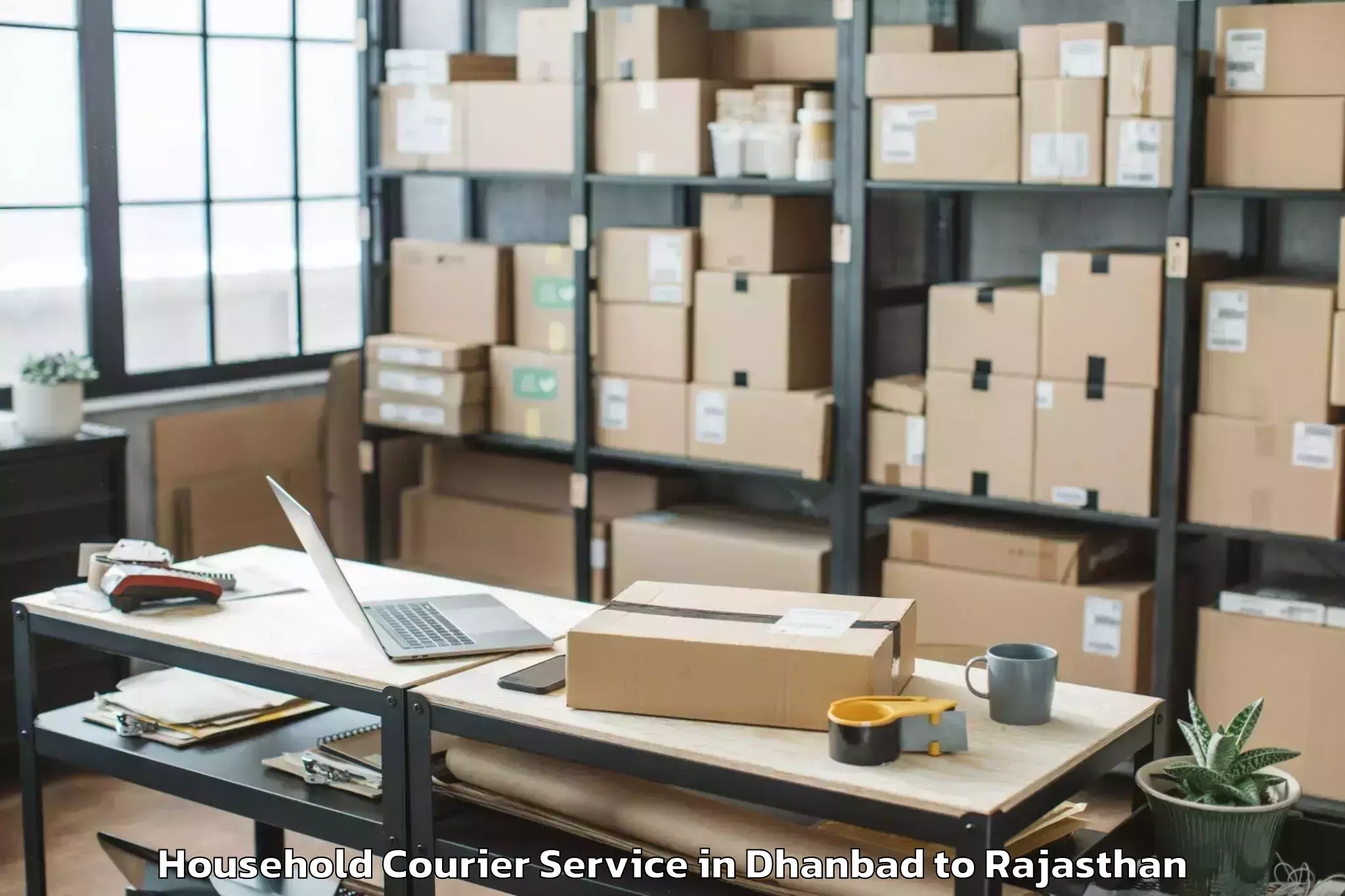 Professional Dhanbad to Raj Rishi Bharthari Matsya Uni Household Courier